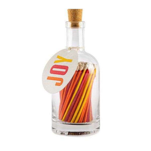 Long luxury matches from archivist in an Apothecary Glass bottle containing colourful matches with a coloured tag with the word 'Joy' on a white background contains approx 125 matches