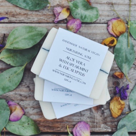 Nurturing soul Aloe Vera and spearmint natural vegan soap bar on decorative background