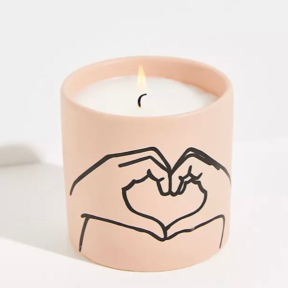 Paddywax Heart Hands Tobacco and Vanilla Soy Wax Candle on a white background