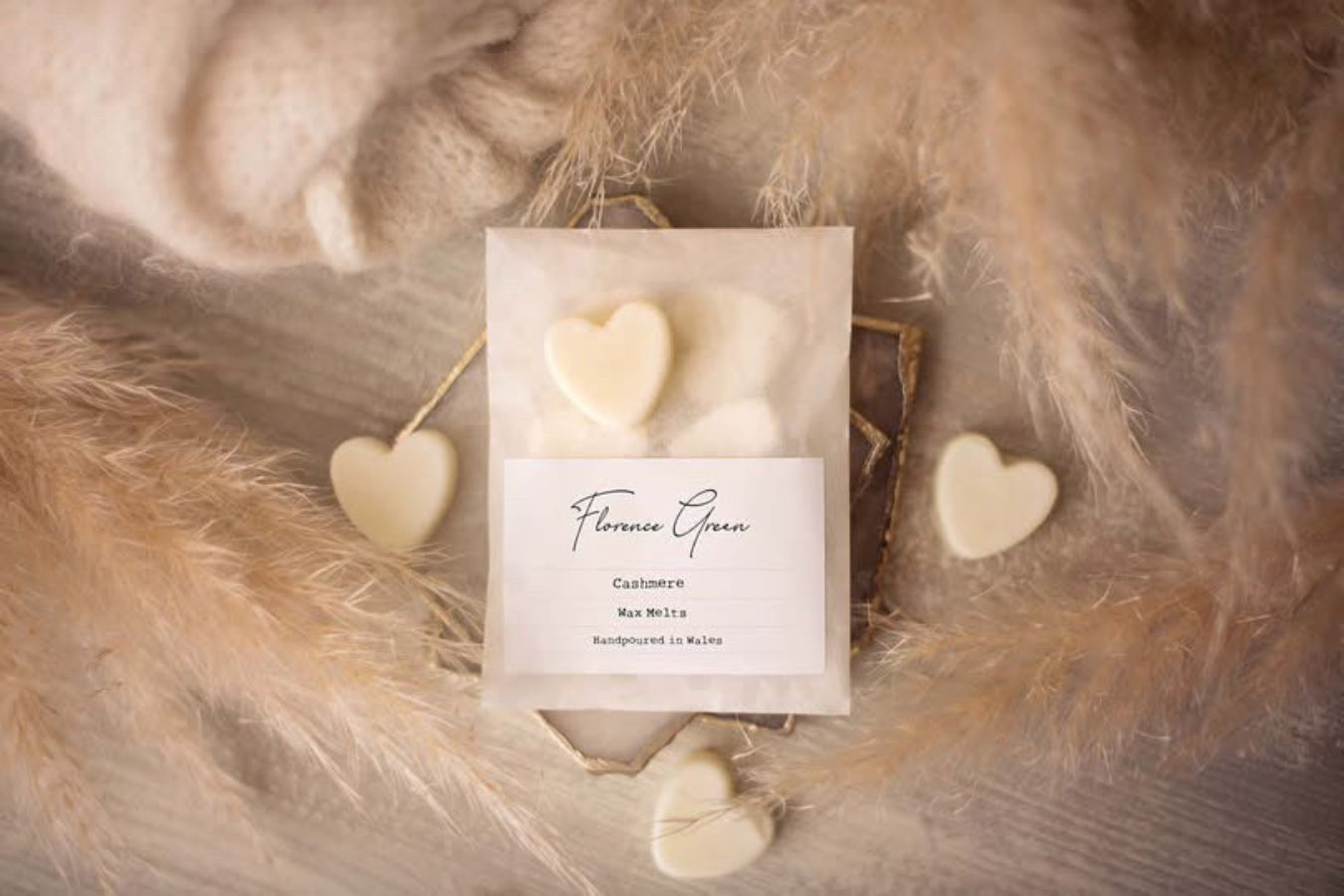 Cashmere scented wax melts from Florence Green on a cream background