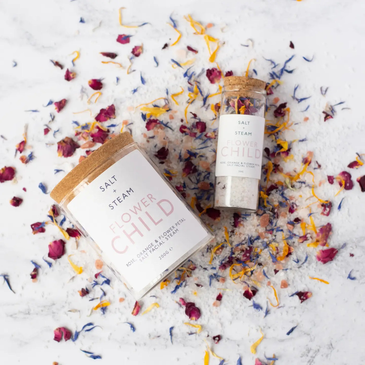 Image of flower child facial steam from Salt and Steam on a white background with petals added for image decoration