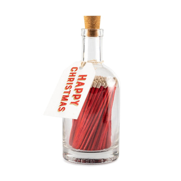 Apothecary Glass bottle containing long red matches with a coloured tag with the word Happy Christmas