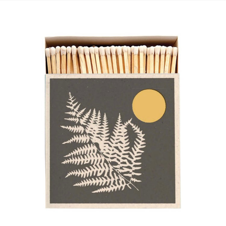 A matchbox with a fern and golden moon printed on the front contains approx 125 long matches