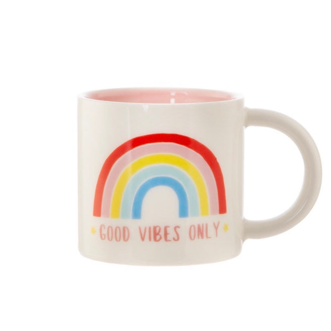 Image of rainbow mug with slogan good vibes only on a white background